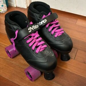 Black and purple roller skates barely worn.